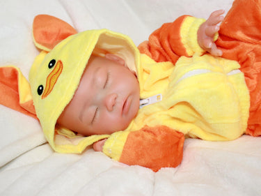 Handmade reborn silicone baby doll, 13-inch lifelike preemie dressed in yellow duck-themed pajamas, realistic collectible newborn doll